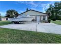 House with boat parking on a paved driveway at 2867 Longleaf Ct, Kissimmee, FL 34746