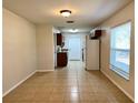 Combined dining and kitchen area with tiled floor at 1940 Tripaul Ct, Bartow, FL 33830