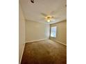 Bright bedroom with carpeted floor and ceiling fan at 1940 Tripaul Ct, Bartow, FL 33830