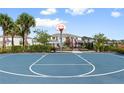 Community basketball court with playground visible in the background at 4523 Cypress Cay Way, Kissimmee, FL 34746