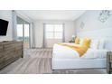 Main bedroom with king-size bed and access to balcony at 1157 Challenge Dr # 1157, Davenport, FL 33896