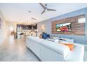 Open living area with white couch and kitchen view at 1157 Challenge Dr # 1157, Davenport, FL 33896