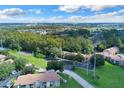 Aerial view of condo community with tennis courts at 4611 Gate Pl # H-203, Orlando, FL 32811