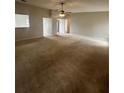 Large living room with carpeted floor and ample space at 406 Long Dr, Kissimmee, FL 34759