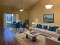 Living room with hardwood floors, city view, and comfy seating at 2181 Cypress Bay Blvd, Kissimmee, FL 34743