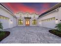 Modern farmhouse exterior with double garage and brick accents at 9752 Laurel Berry Dr, Orlando, FL 32827