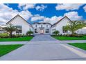Modern farmhouse exterior with landscaping and double garage at 9752 Laurel Berry Dr, Orlando, FL 32827