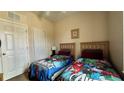 Bedroom with two twin beds and ample closet space at 2716 Bushman Dr, Kissimmee, FL 34746