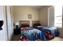 Guest bedroom with two twin beds at 2716 Bushman Dr, Kissimmee, FL 34746