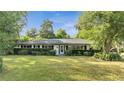 Ranch home with a large yard at 715 Eastover Cir, Deland, FL 32724