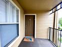 Apartment entry with private balcony and welcome mat at 2210 Grand Cayman Ct # 1722, Kissimmee, FL 34741