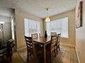Bright dining area with a table and chairs, perfect for Gathering meals at 2210 Grand Cayman Ct # 1722, Kissimmee, FL 34741