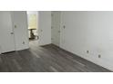 Bright bedroom with grey vinyl flooring and an ensuite bathroom at 3727 Lake Orlando Pkwy # 4, Orlando, FL 32808