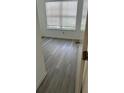 Bedroom featuring grey vinyl flooring and a large window with blinds at 3727 Lake Orlando Pkwy # 4, Orlando, FL 32808