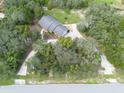 Aerial view of house with circular driveway at 6365 Whip O Will E Ln, Saint Cloud, FL 34771