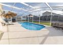 Private screened pool with patio furniture at 1104 Bloomingdale Dr, Davenport, FL 33897