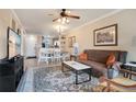 Open living room featuring a brown couch and dining area at 901 Charo Pkwy # 721, Davenport, FL 33897
