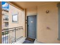 Inviting entryway with a gray door and a welcome mat at 901 Charo Pkwy # 721, Davenport, FL 33897