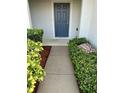 Welcoming front entry with walkway and landscaping at 1034 Chalcedony St, Kissimmee, FL 34744