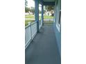 Front porch with white railing and blue walls at 106 Sparrow Ct, Kissimmee, FL 34759
