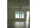 Living room with tile floors and view of pool at 106 Sparrow Ct, Kissimmee, FL 34759
