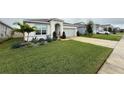 House exterior with well-manicured lawn at 5652 Arborvista Dr, Saint Cloud, FL 34771