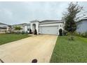 House exterior with well-manicured lawn at 5652 Arborvista Dr, Saint Cloud, FL 34771