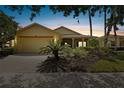 House exterior at dusk with landscaping at 196 Ventana Dr, Poinciana, FL 34759