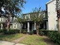 Two-story house with front porch and landscaping at 13155 Kegan St, Windermere, FL 34786