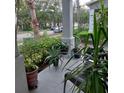 Relaxing front porch with potted plants and seating at 13155 Kegan St, Windermere, FL 34786