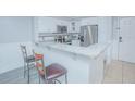 Modern kitchen with granite countertops and stainless steel appliances at 14036 Fairway Island Dr # 1515, Orlando, FL 32837