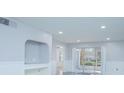 Bright living room with recessed lighting and sliding glass doors at 14036 Fairway Island Dr # 1515, Orlando, FL 32837