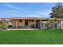 Covered patio area with access to the backyard at 450 Tivoli Park Dr, Davenport, FL 33897
