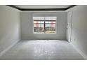 Bright and airy living room with large window at 2727 W Oak Ridge Rd # 3, Orlando, FL 32809