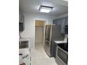 Modern kitchen with stainless steel appliances at 2727 W Oak Ridge Rd # 3, Orlando, FL 32809