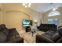 Spacious living room with comfortable seating and large TV at 523 Balmoral Dr, Davenport, FL 33896