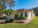 Well-maintained house with a landscaped yard and a paved walkway at 657 Vineyard Way, Kissimmee, FL 34759