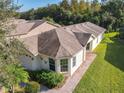 Aerial view of the house, showing its layout and landscaping at 657 Vineyard Way, Kissimmee, FL 34759