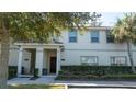 Townhome exterior with landscaping and walkway at 4845 Romeo Cir, Kissimmee, FL 34746