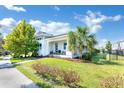 Modern house exterior showcasing a landscaped lawn and walkway at 13010 Stoddart Ave, Orlando, FL 32827