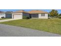One-story home with a screened-in patio and yard at 3381 Marshfield Preserve Way, Kissimmee, FL 34746