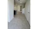 Bright entryway with tile flooring leading to the kitchen and living room at 2893 Fitness St, Clermont, FL 34714