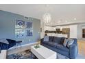 Open concept living room and kitchen at 4751 Clock Tower Dr # 106, Kissimmee, FL 34746