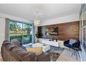 Modern living room with sliding door access to balcony at 4751 Clock Tower Dr # 106, Kissimmee, FL 34746