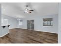 Open living area with wood-look floors and high ceilings at 3570 Manor Loop, Lakeland, FL 33810