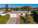Single-Gathering home with driveway and yard, neighborhood context visible at 1402 Westminster Way, Kissimmee, FL 34744