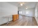 Bright living room with laminate floors and ceiling fan at 1015 Ohio Ave, Saint Cloud, FL 34769