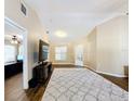 Living room with dark brown leather couches and a large TV at 119 Talavera Ln, Kissimmee, FL 34758