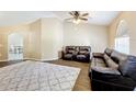 Living room featuring a ceiling fan and neutral decor at 119 Talavera Ln, Kissimmee, FL 34758