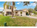 Two-story house with a two-car garage and palm tree at 4758 Wyresdale St, Orlando, FL 32808
